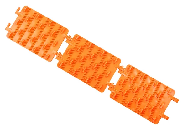 白色の背景に隔離されたオレンジ色のプラスチック折り畳み式の緊急牽引パッド — ストック写真