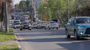 car traffic passing repairing bridge at summer day in Tula, Russia, real-time