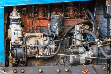 close view of opened diesel engine compartment of old belarussian farm tractor