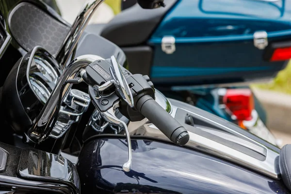 2022 Harley-Davidson Road Glide Limited Motorcycle on asphalt parking at spring day - close view on left handle - in Tula, Russia - June 5, 2022