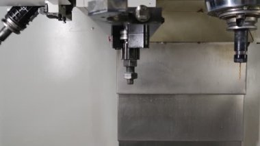 automatic tool change in modern vertical cnc milling machine.