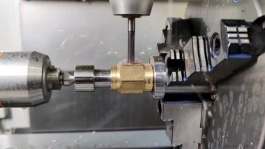 Process of vertical drilling in modern 4-axis CNC milling machine.