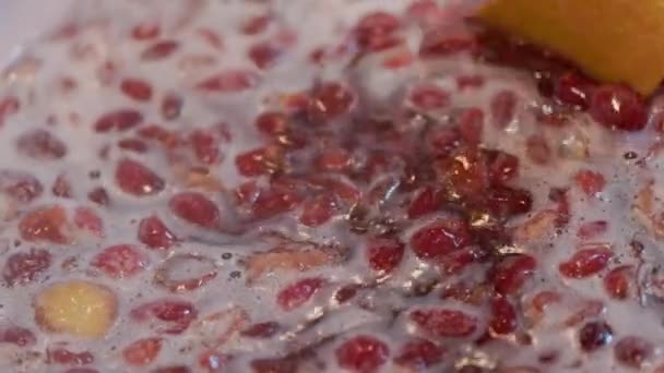 Wooden Spoon Stirring Boiling Domestic Cherry Jam Full Frame Closeup — Stockvideo