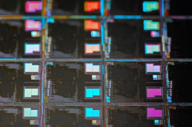 Silicon monocrystalline wafer with microchips after photolithography etching manufacturing used in fabrication of electronic integrated circuits. Full-frame high-tech macro background.
