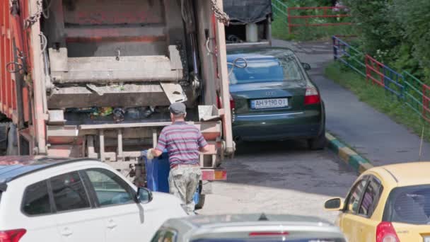 Worker Overturns Blue Trash Bucket Dump Truck Parked Cars Summer — Stock Video