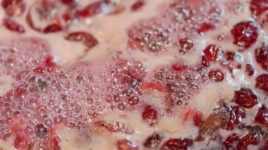 domestic cherry jam boiling - full-frame closeup in realtime