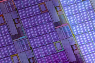 Silicon monocrystalline wafer with microchips after photolithography etching manufacturing used in fabrication of electronic integrated circuits. Full-frame high-tech macro background.