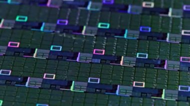 full-frame looped spinning silicone microchip wafer with gold colored chips, real-lofe video footage