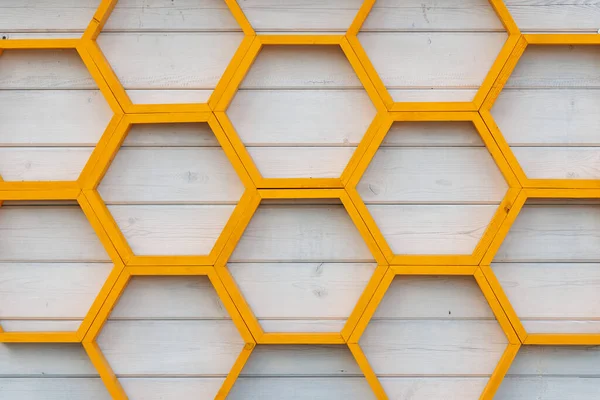Yellow Honeycomb Pattern Wooden Shelf White Painted Wooden Plank Wall — Stockfoto