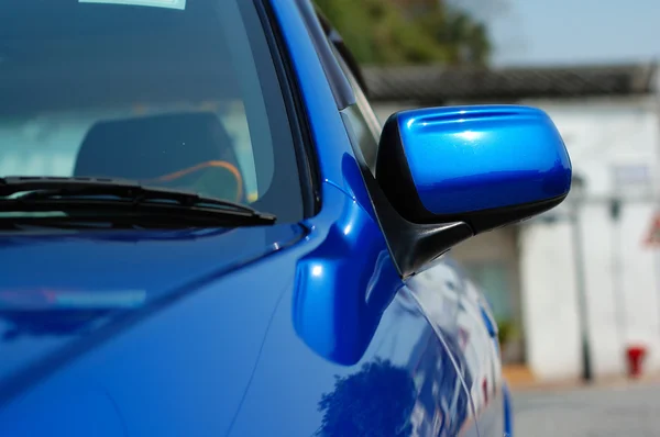 Right side mirror of shiny blue car — Stock Photo, Image