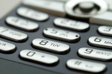 Mobil tuş takımının ışık altında yakın çekim görüntüsü
