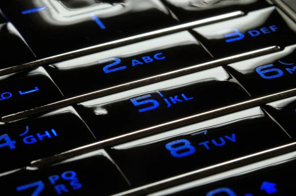 Close up shot of blue mobile keypad under dark environment — Stock Photo, Image