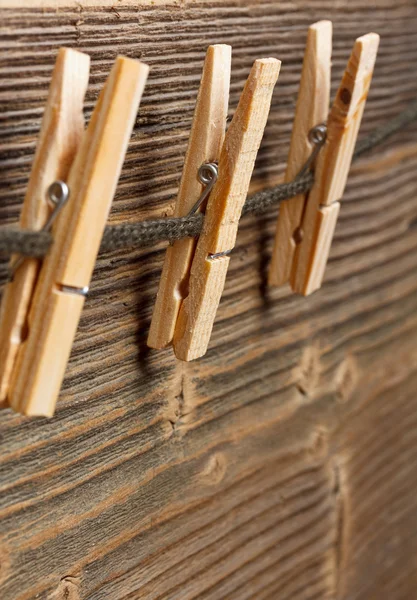 Three clothespins on rope — Stock Photo, Image