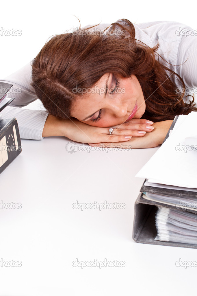 Business woman sleeping while at work