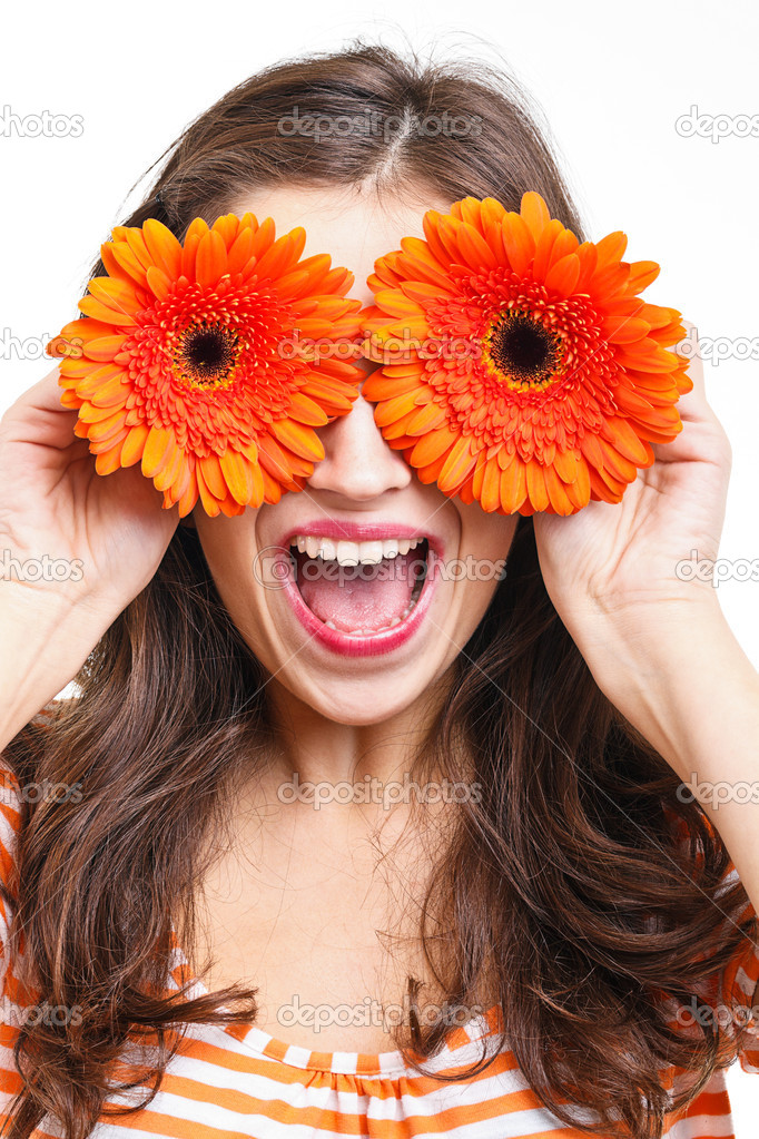 Woman covering her eyes with flowers \u2014 Stock Photo