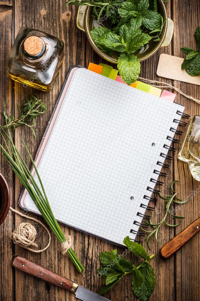 Open notebook with herbs