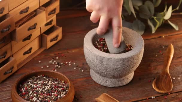 Man Hand Grinds Mixed Peppercorns Pestle White Stone Mortar — Stock Video