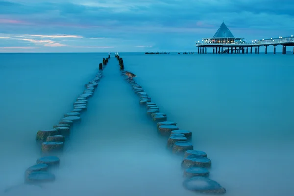 Old and new pier at dusk — Stock Photo, Image