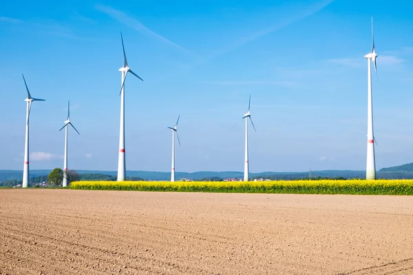 Barren field and windwheels — Stock Photo, Image