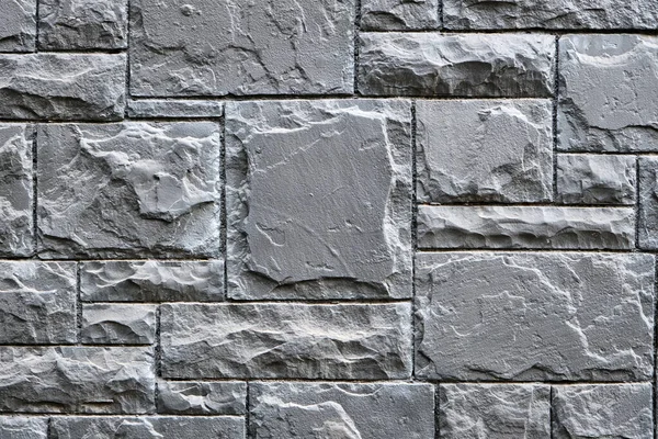 Achtergrond Van Een Muur Gemaakt Van Grijze Granieten Stenen — Stockfoto