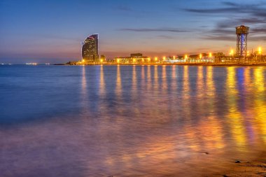 Barceloneta beach in Barcelona, Spain, at dusk