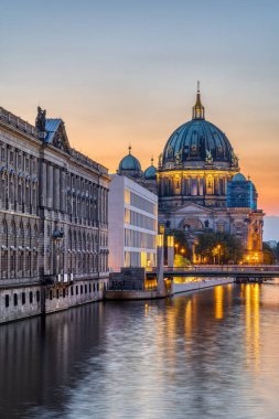 View along the River Spree in Berlin at dusk with the Cathedral in the back
