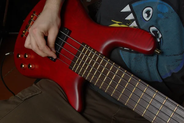 Playing a red guitar — Stock Photo, Image