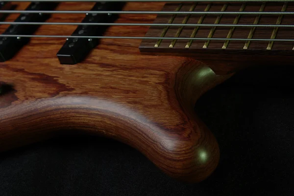 Guitar with brown body on black — Stock Photo, Image