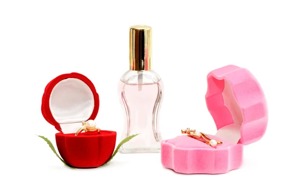 Gouden ornamenten en fles parfum — Stockfoto