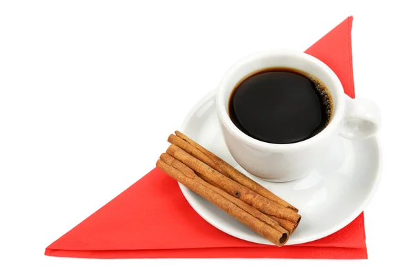 Una taza de café en una servilleta roja —  Fotos de Stock