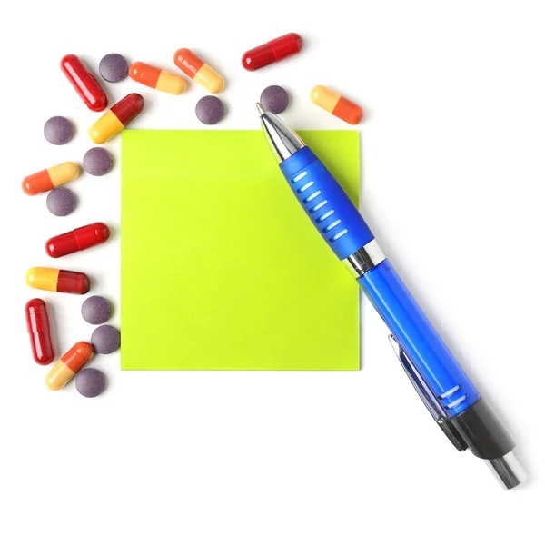 Mediciner, penna och papper för recept. — Stockfoto