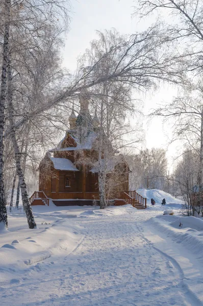 Russian wooden chapel in winter forest — Stock Photo, Image