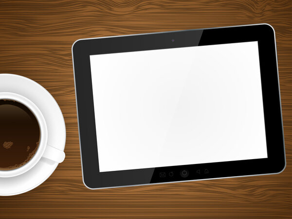 Coffee cup and tablet pc on wooden background