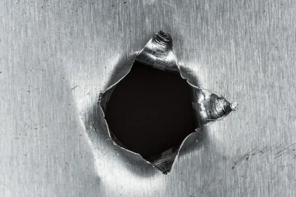 Bullet hole in sheet metal — Stock Photo, Image