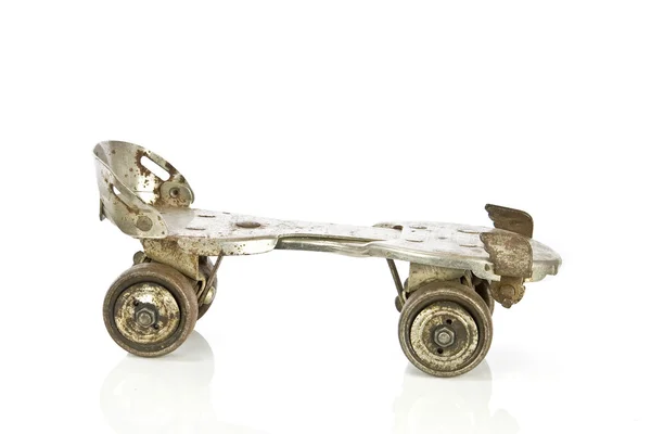 Old clamp-on roller skates on white — Stock Photo, Image