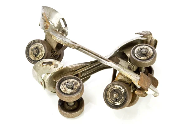 Old clamp-on roller skates on white — Stock Photo, Image