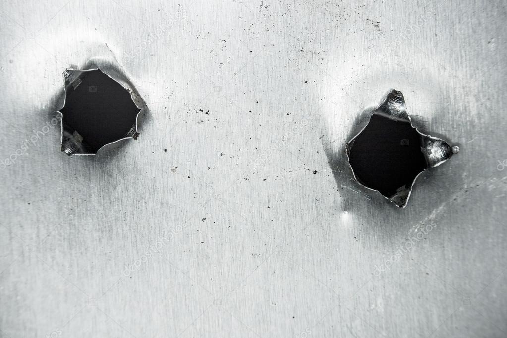 Bullet hole in sheet metal