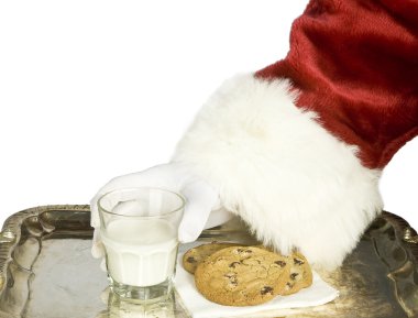Noel Baba el sütü çikolatalı kurabiye ile tutarak