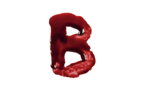 Tropfendes Blut schreibt den Buchstaben b — Stockfoto