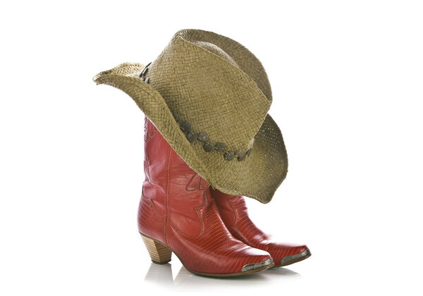 Dirty cowboy boots and hat isolated