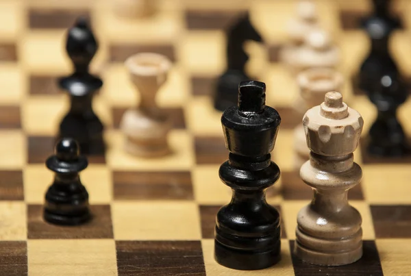 Chess pieces on a chess board table — Stock Photo, Image