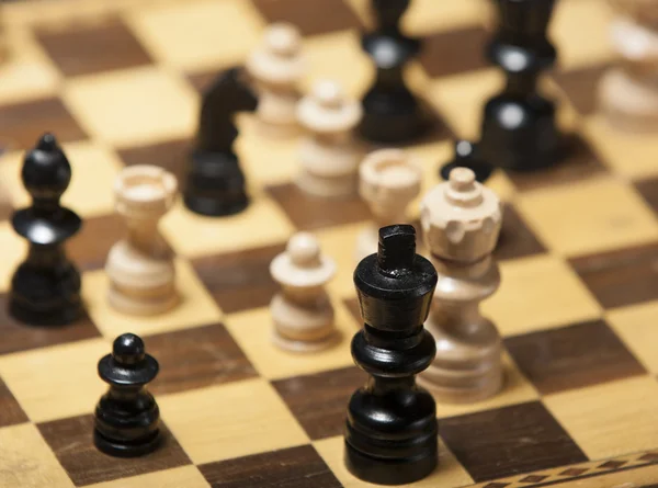 Chess pieces on a chess board table — Stock Photo, Image