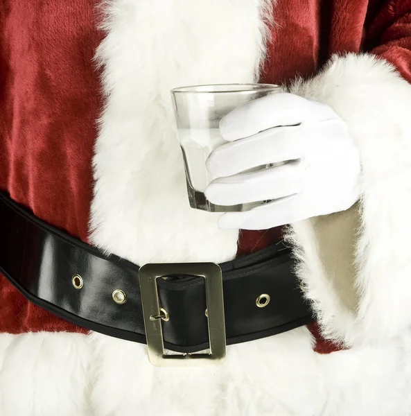 Père Noël tenant un verre de lait — Photo