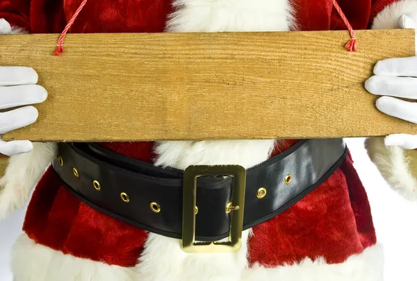 Santa claus holding a blank wooden sign — Stock Photo, Image