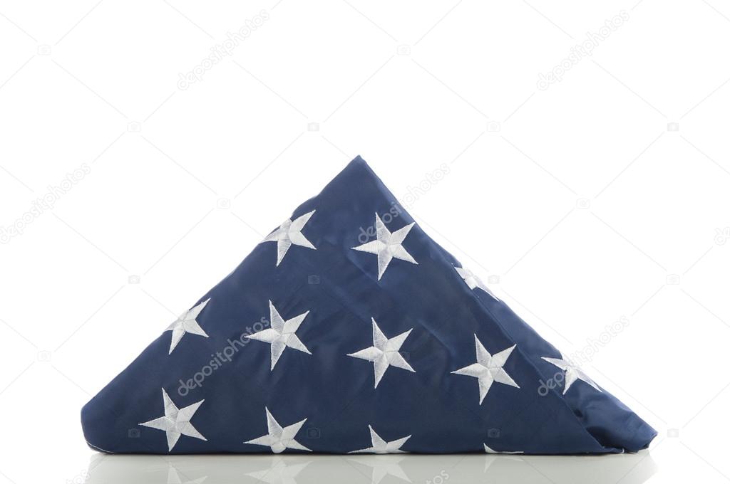 American flag folded on white background