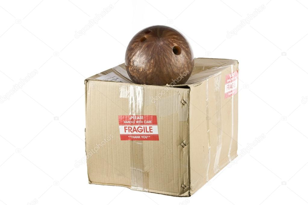Damaged box from bowling ball with the fragile sticker on it