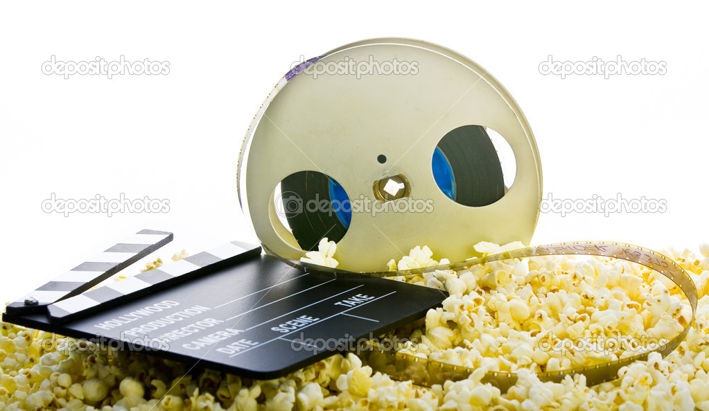Film reel in popcorn isolated on white