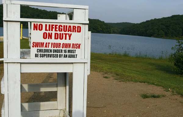 Sign No lifeguard on duty — Stock Photo, Image