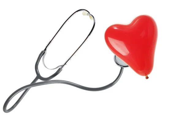 Tethoscope met een rood hart ballon — Stockfoto