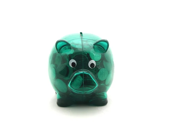 Zöld átlátszó piggy bank néhány érmét, elszigetelt fehér Stock Kép